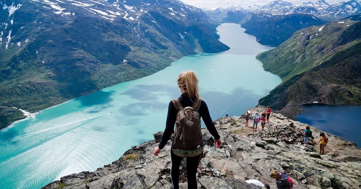 Person walking on a scenic outdoor trail in Norway